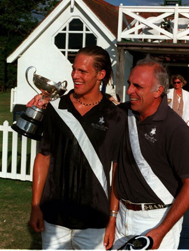 Morrison, right, with his son Jamie after a polo tournament, was the oldest man to play for Britain 