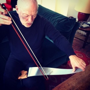 David Gilmour playing a saw with a bow