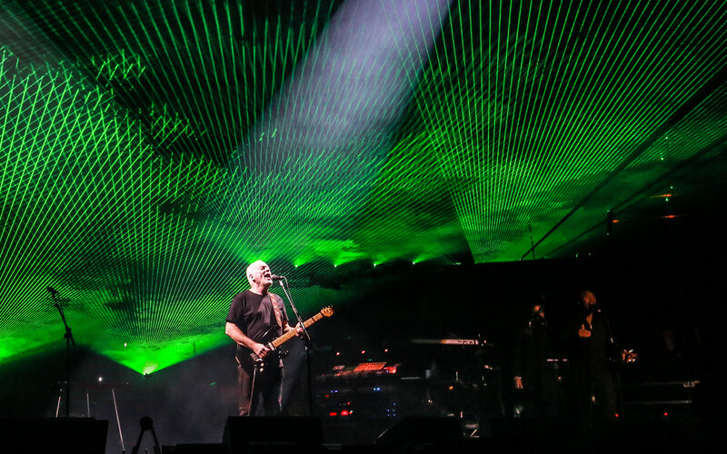 David Gilmour performing live at a concert in 2025