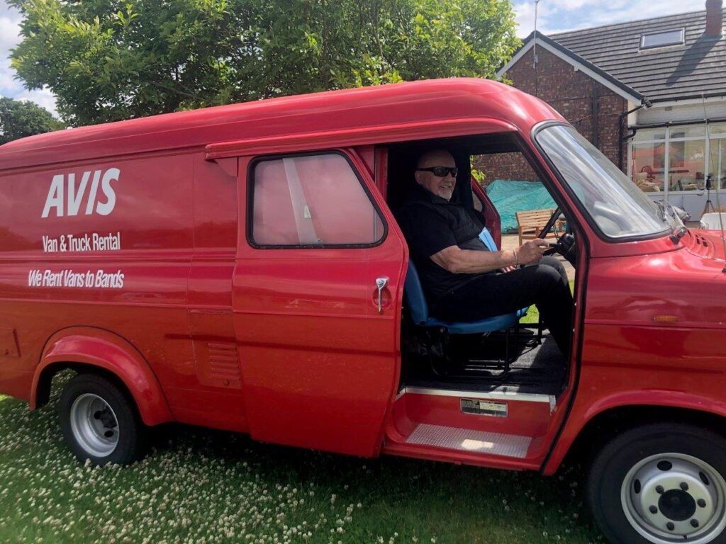 Chris Adamson in an Avis band equipment hir van