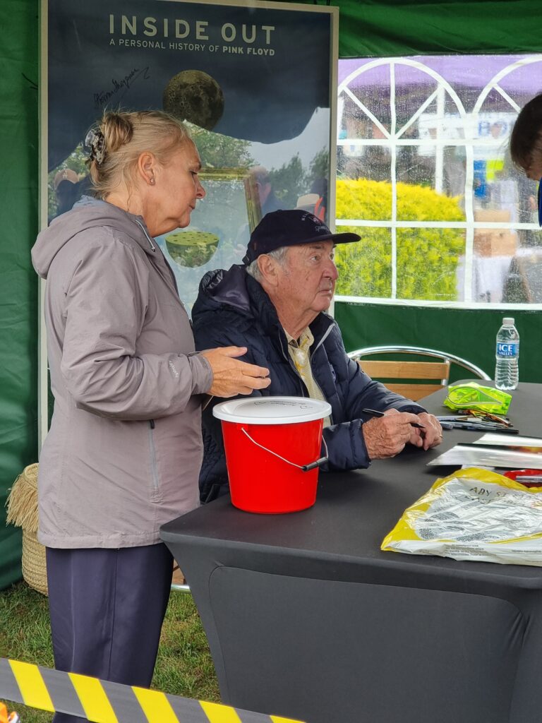 Nick Mason signing fans memorabilia