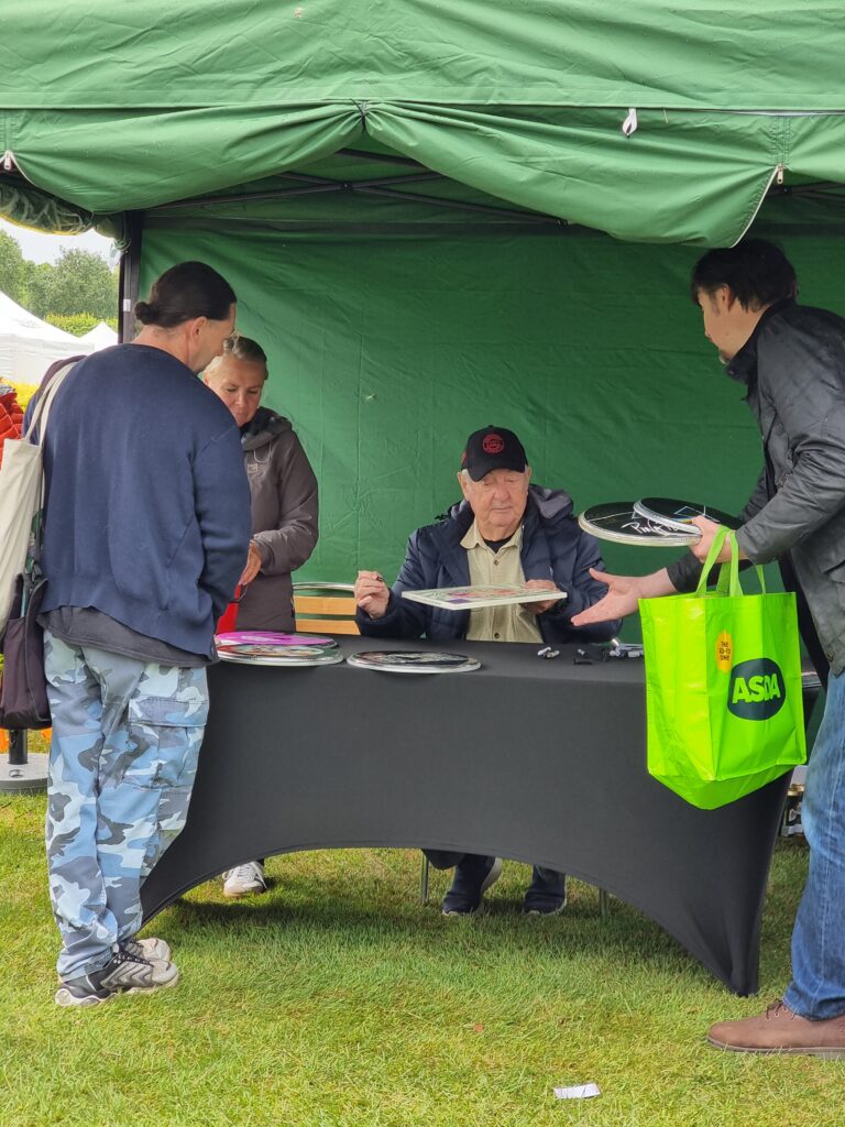 Nick Mason signing fans memorabilia